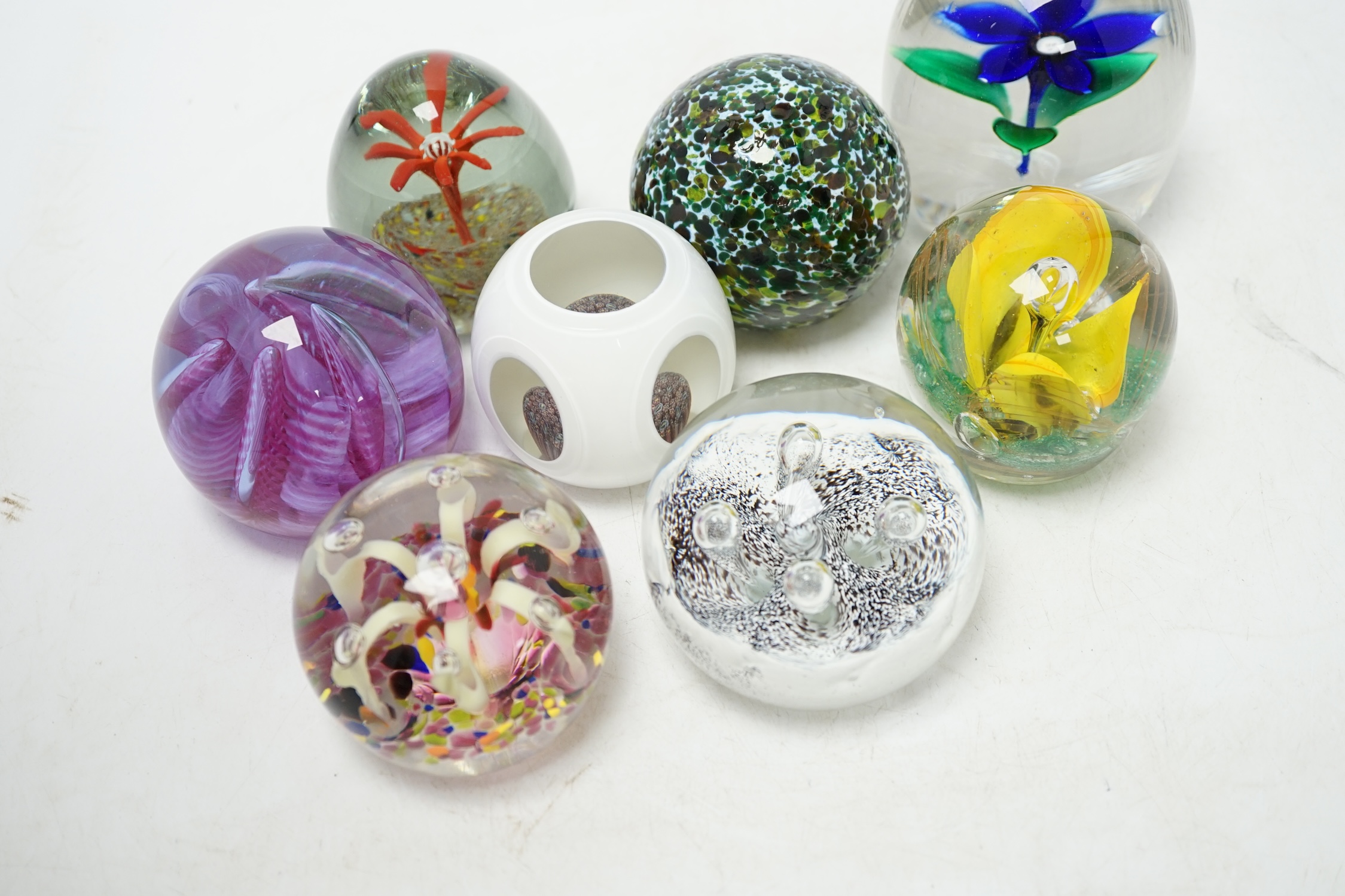 A group of eight various glass paperweights, tallest 10cm. Condition - fair to good